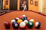 Woman playing pool