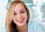 Happy smiling girl with blue background