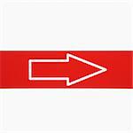 Red sign with arrow against white background.