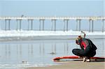 Young surfer at the beach