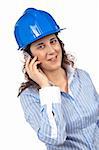 A smiling female architect talking with phone