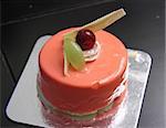 Strawberry mousse cake round shape cream and grape decoration