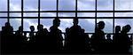 People waiting in line at the airport silhouette