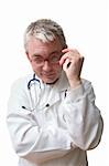 Concentrated doctor in glasses with stethoscope.
