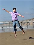Boy jumping on the beach