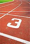 number three of a racetrack, on red tarmac, for runners.