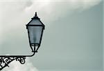 Old classic street lantern against the sky