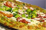 Vegetarian pizza with tomatoes and broccoli