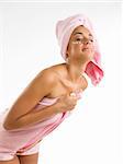 nice girl with pink towel and cream on her face and a turban