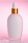 Cosmetic Cream Bottle on pink
