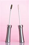 Two mascaras with pink cast