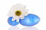 Vivid blue stones and a daisy