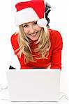 Christmas girl on a laptop computer, shopping for gifts,  banking, etc online.