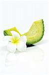 A slice of avocado isolated with tropical flower