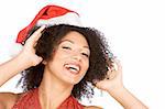 Headshot of happy gesturing attractive female in Santa hat. (high key)