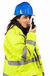 Female construction worker talking with a walkie talkie, over a white background