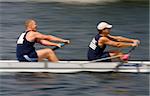 A motion blurred shot of a pair of rowers working hard to win a race