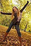 20-25 years old beautiful sexy woman portrait playing in natural autumn outdoors