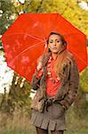 20-25 years old beautiful sexy woman portrait holding umbrella in natural autumn outdoors