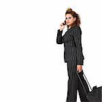 Businesswoman pulling her luggage, isolated on white background; copy space.