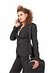 Business woman with computer bag, speaking on her cell phone; isolated on white background.