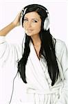 Portrait of Beautiful brunette woman listen to music with headphones