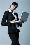 Beautiful brunette business woman with laptop computer isolated on clear background