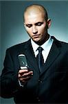 A Young businessman using cell phone