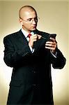 A businessman using PDA computer