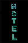 Blue motel neon sign illuminated at night
