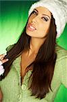 Portrait of beautiful woman wearing green sweater an white hat