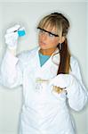 Beautiful female lab worker testing and experimenting