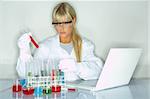 Beautifula female lab worker testing and experimenting
