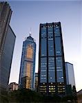 Downtown office buildings in Wan Chai, Hong Kong, in the late sunset before evening. Beautiful blue sky