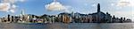 Hong Kong panorama of city on a beautiful blue sky day. Victoria Harbour from Kowloon