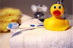 Rubber duck, toothbrush and sponge ready for bathtime