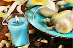 Blue aromatherapy candle and spa stones