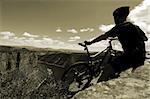 Biker taking a break from the trail, Flaming Gorge, Utah