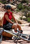 Female mountain biker taking a break