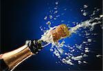 Champagne splash. Bottle and cork, celebration time