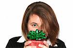 Beautiful girl holding up a wrapped gift: Christmas or other holiday concept