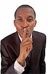 This is an image of businessman with his hands on his lips. This posture implies "Silence"