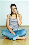 Young woman talking by cell phone