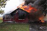 Abandoned house in flame, house is still up but flames are all over