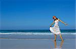 Woman in a beautiful morning on the beach