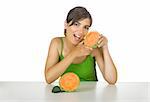 Beautiful young woman eating a cantaloupe