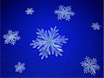 crystal snowflakes over blue background with feather center