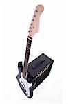 Electric guitar and amplifier isolated over white background
