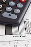 Business papers and calculator - focus on the words cash flow