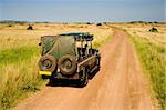 Jeep on safari in African savannah, Kenya.